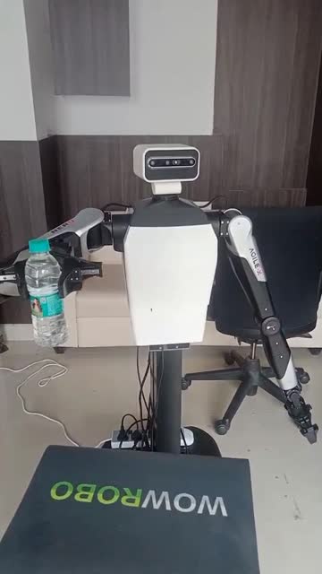Real TARA robot grasping, lifting, and returning a water bottle to a table